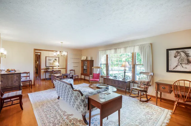 a kitchen with stainless steel appliances granite countertop a refrigerator and a cabinets