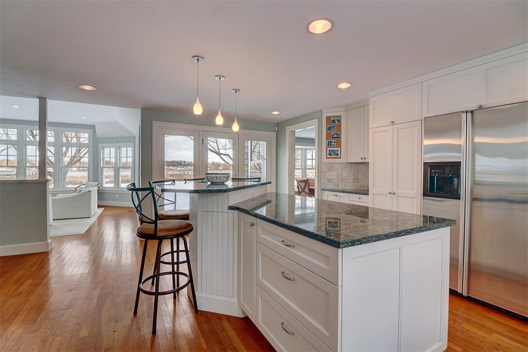 160 Adams Point Road Barrington, RI 02806 - Photo 11 of 40 A French door leads out to a stone patio for outside entertaining.