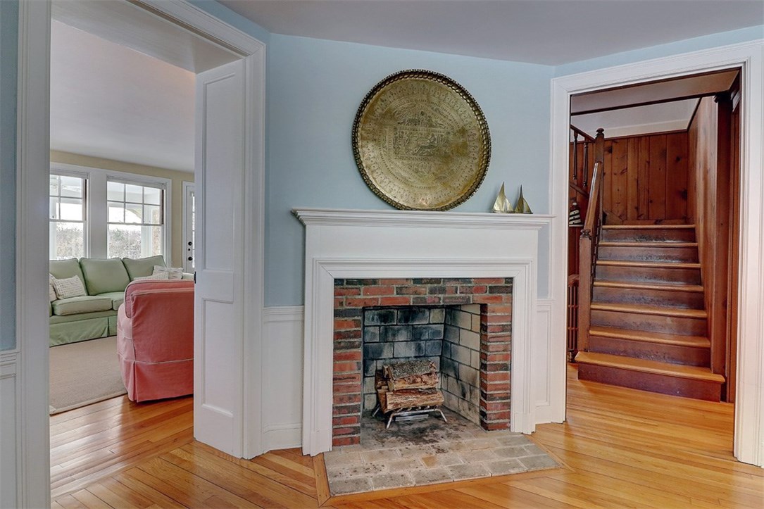 160 Adams Point Road Barrington, RI 02806 - Photo 13 of 40 The dining room fireplace is wood burning with a beautiful period mantle.