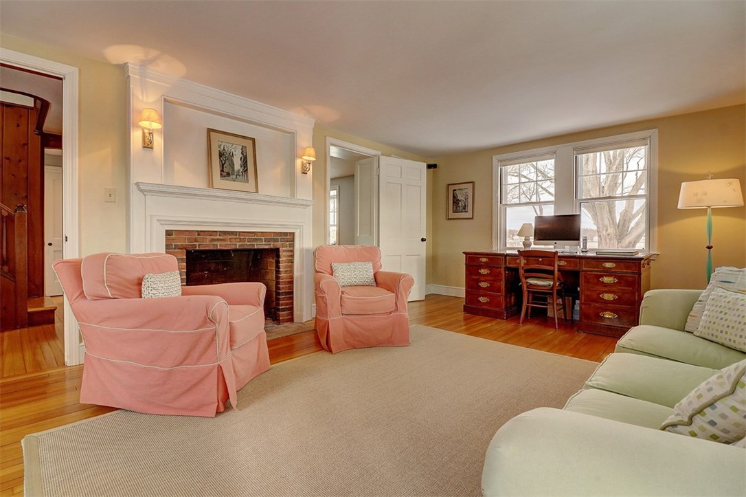 160 Adams Point Road Barrington, RI 02806 - Photo 15 of 40 Large living room with fireplace, hardwood floors and built-ins.