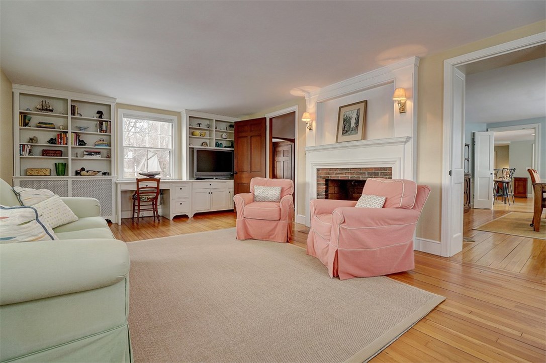 160 Adams Point Road Barrington, RI 02806 - Photo 16 of 40 Living room has built-ins and has views of the water.