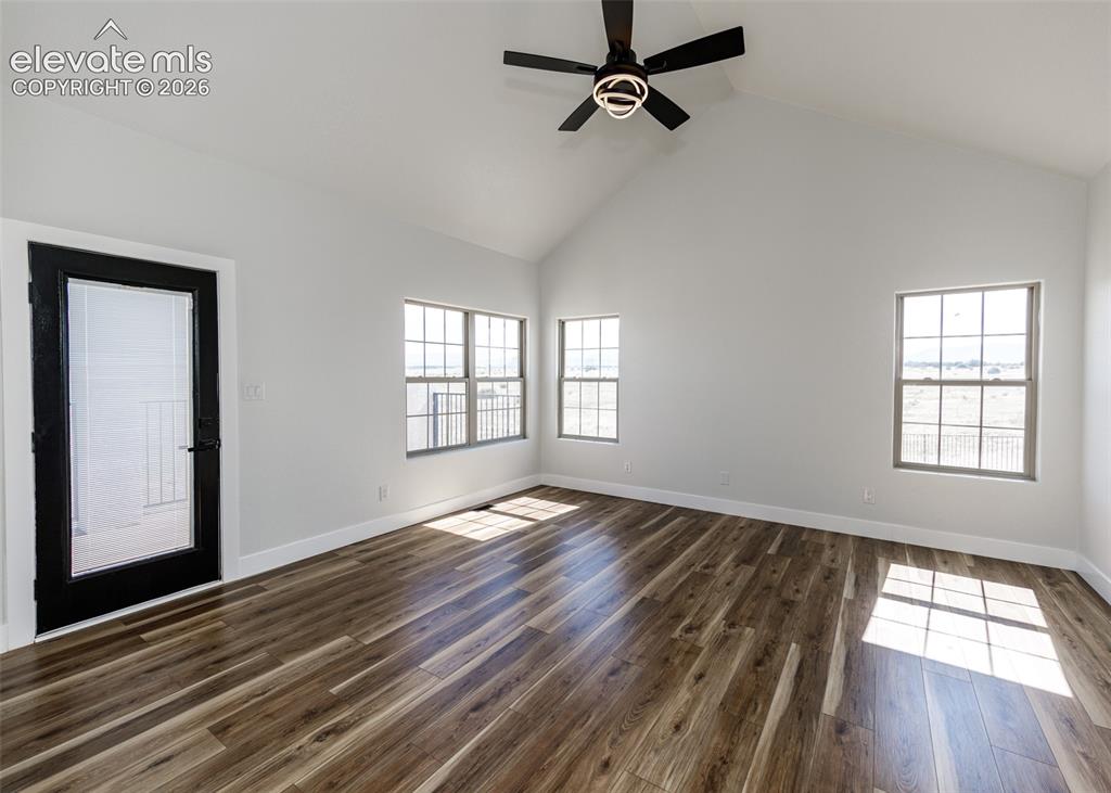 1120 Newton Road Pueblo, CO 81005 - Photo 12 of 46 a view of empty room with wooden floor and fan
