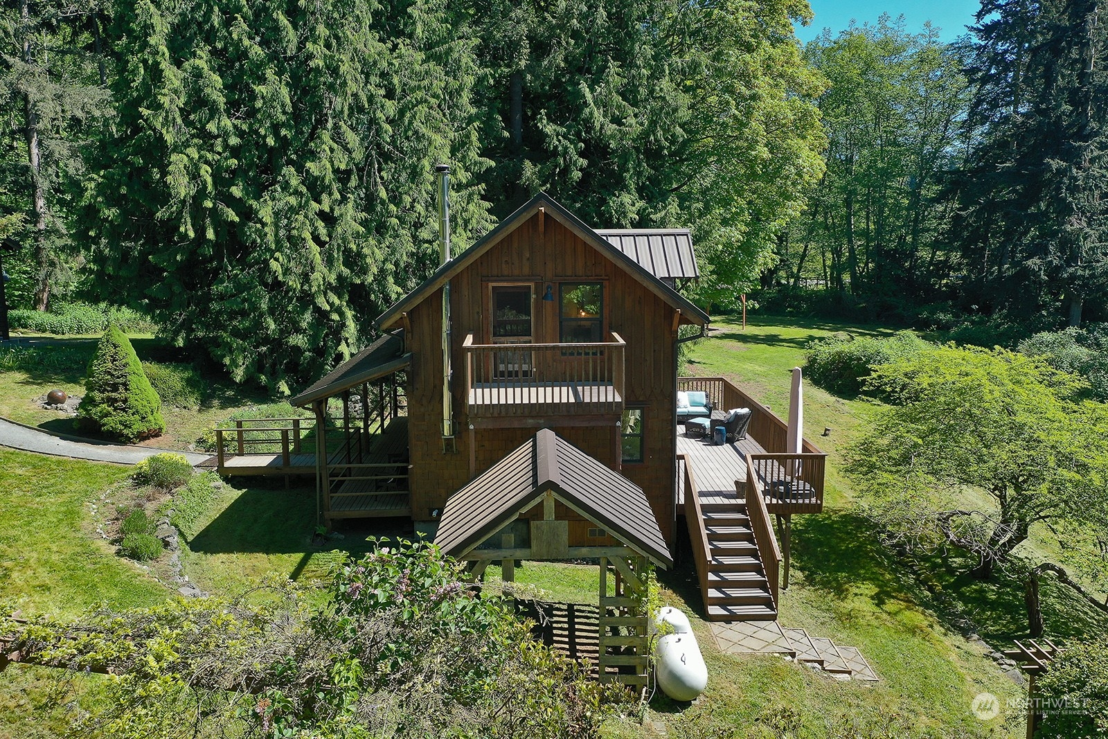 5368 Mapleglen Road Langley, WA 98260 - Photo 35 of 40 a house view with a garden