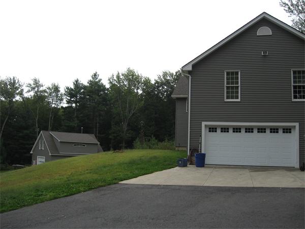53 Bunyan Road Monson, MA 01057 - Photo 8 of 30 a front view of a house with a yard