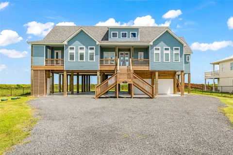 a view of residential houses with swimming pool