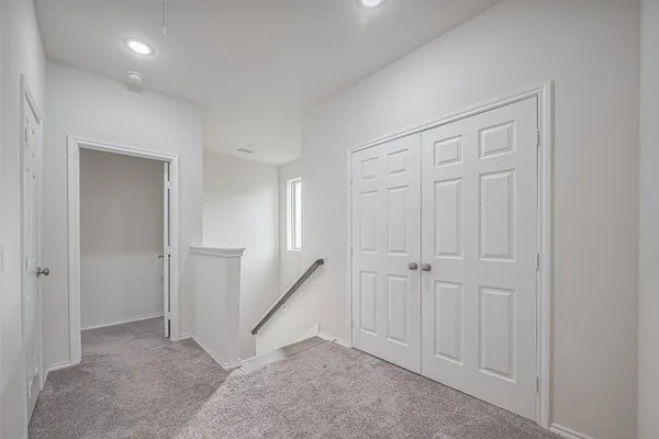 an empty room with a hallway