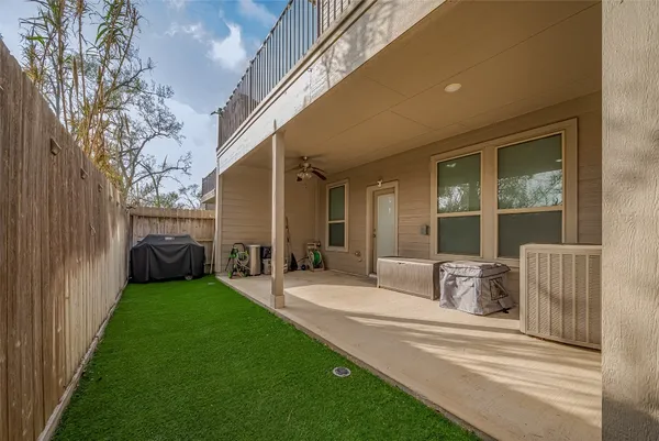 a view of a house with backyard and porch
