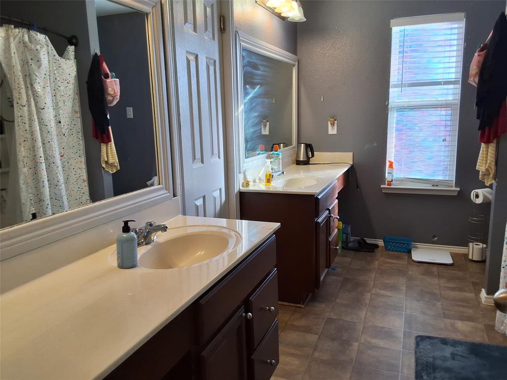 112 Hancock Street Venus, TX 76084 - Photo 22 of 25 Dual vanity setup with light-toned countertops and integrated sinks