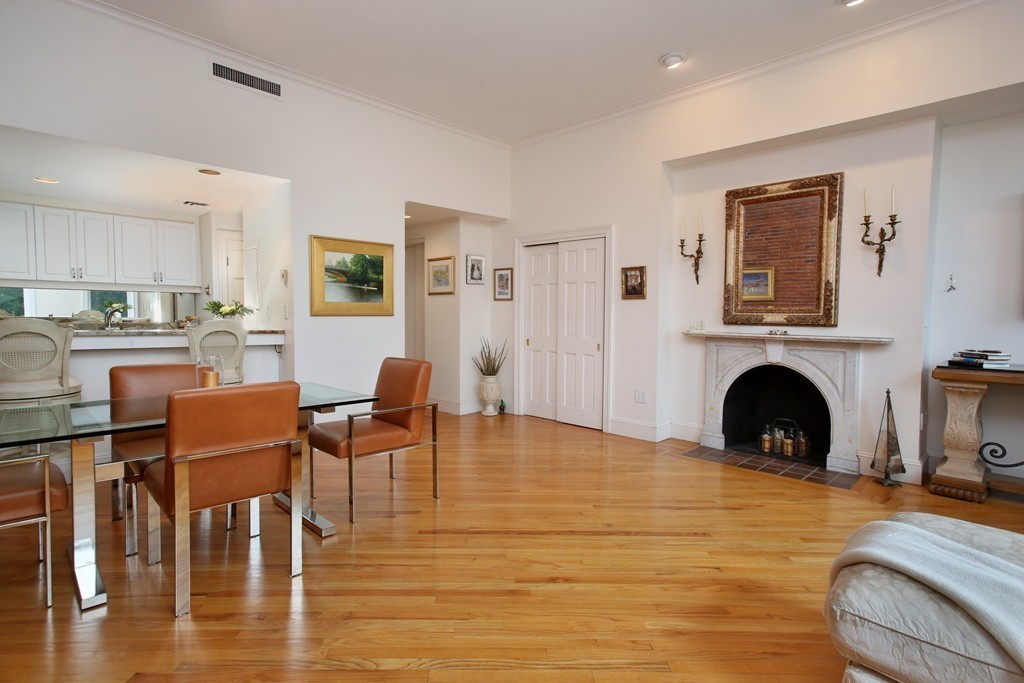 136 Beacon Street, Unit 7 Boston, MA 02116 - Photo 2 of 7 a living room with furniture and a fireplace