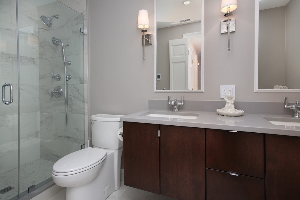 136 Beacon Street, Unit 7 Boston, MA 02116 - Photo 5 of 7 a bathroom with a sink toilet and a mirror