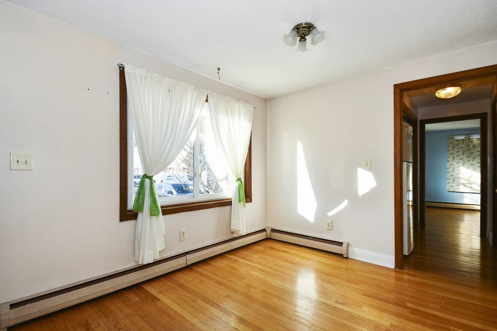 164 Ayer Road, Unit H4 Shirley, MA 01464 - Photo 15 of 33 wooden floor in an empty room with a window