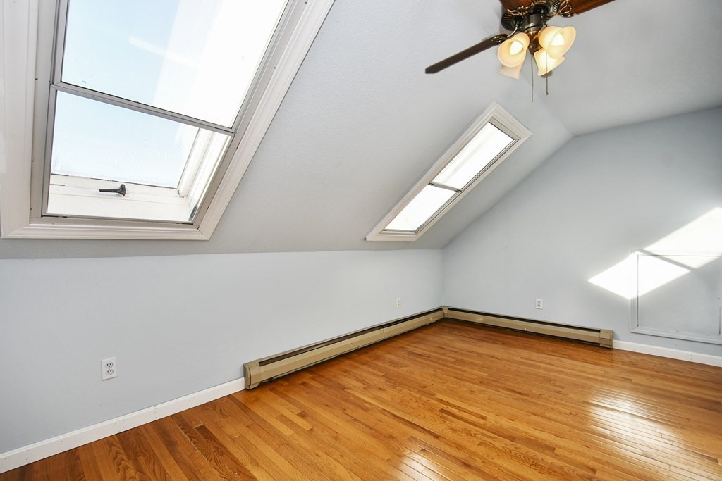 164 Ayer Road, Unit H4 Shirley, MA 01464 - Photo 16 of 33 a view of empty room with wooden floor and fan
