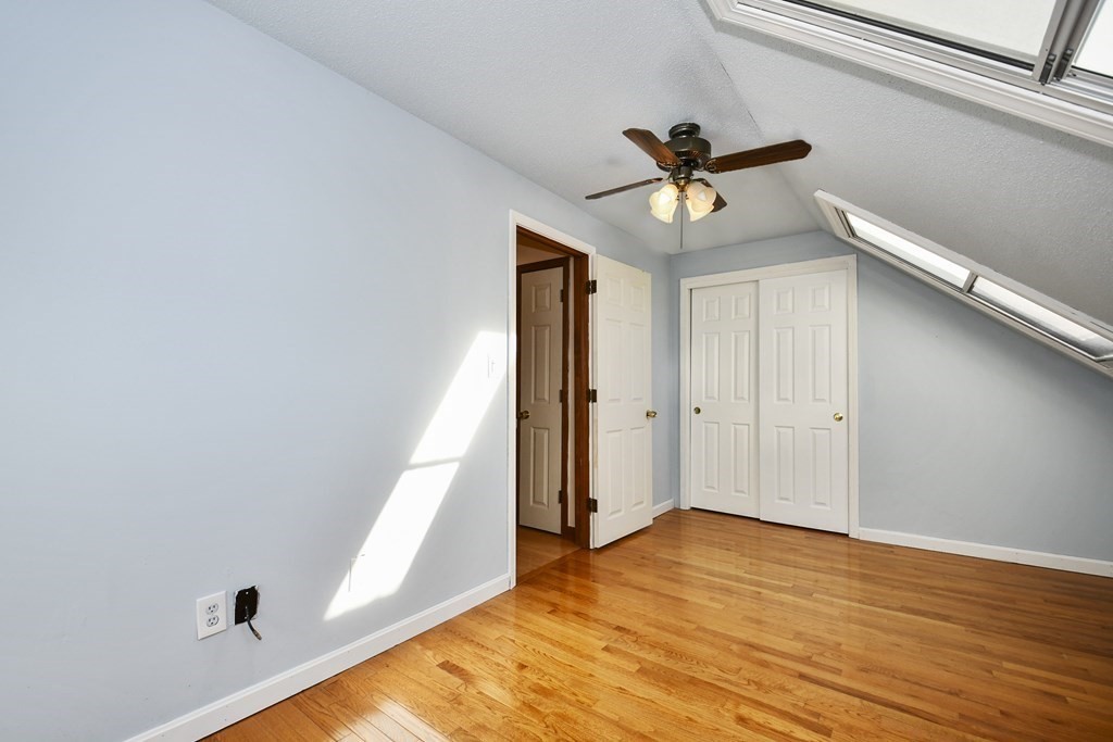 164 Ayer Road, Unit H4 Shirley, MA 01464 - Photo 17 of 33 a view of a livingroom with a ceiling fan and window