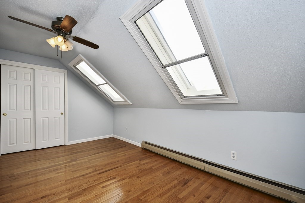 164 Ayer Road, Unit H4 Shirley, MA 01464 - Photo 18 of 33 a view of empty room with wooden floor and fan