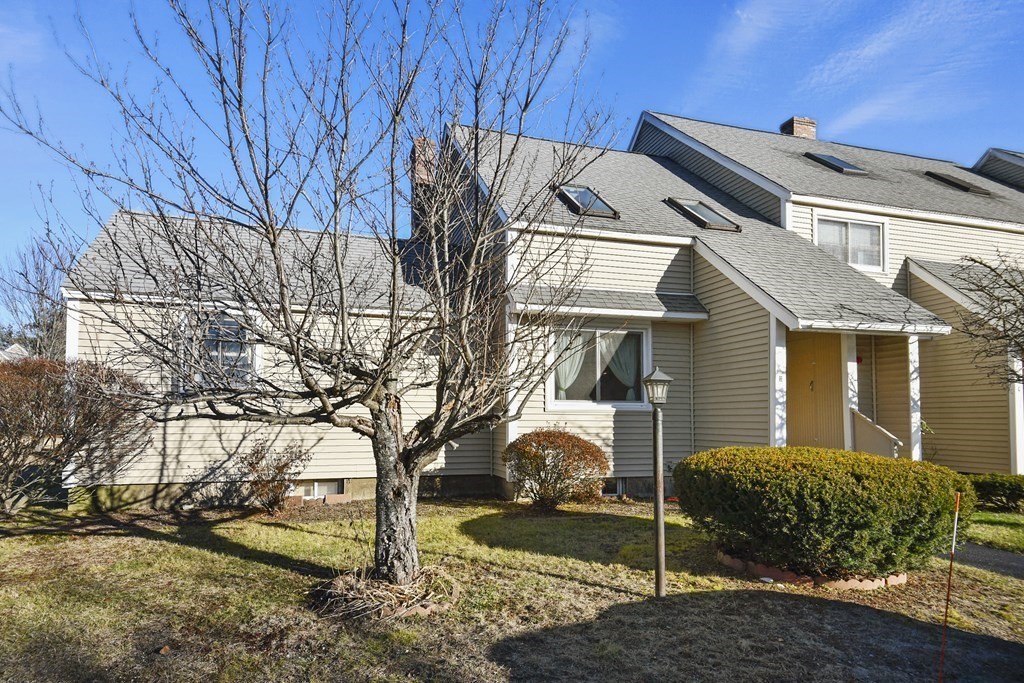 164 Ayer Road, Unit H4 Shirley, MA 01464 - Photo 2 of 33 a view of a house with a yard