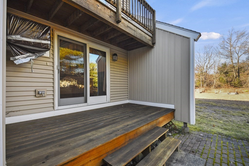 164 Ayer Road, Unit H4 Shirley, MA 01464 - Photo 26 of 33 a view of backyard with wooden floor and a outdoor space