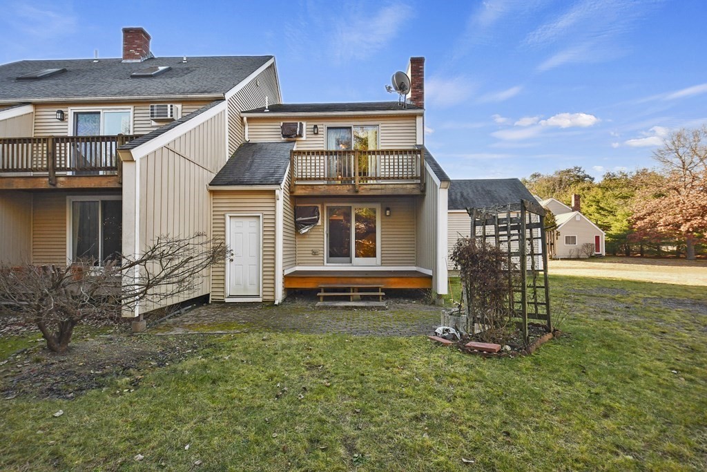 164 Ayer Road, Unit H4 Shirley, MA 01464 - Photo 28 of 33 a view of a house with a yard