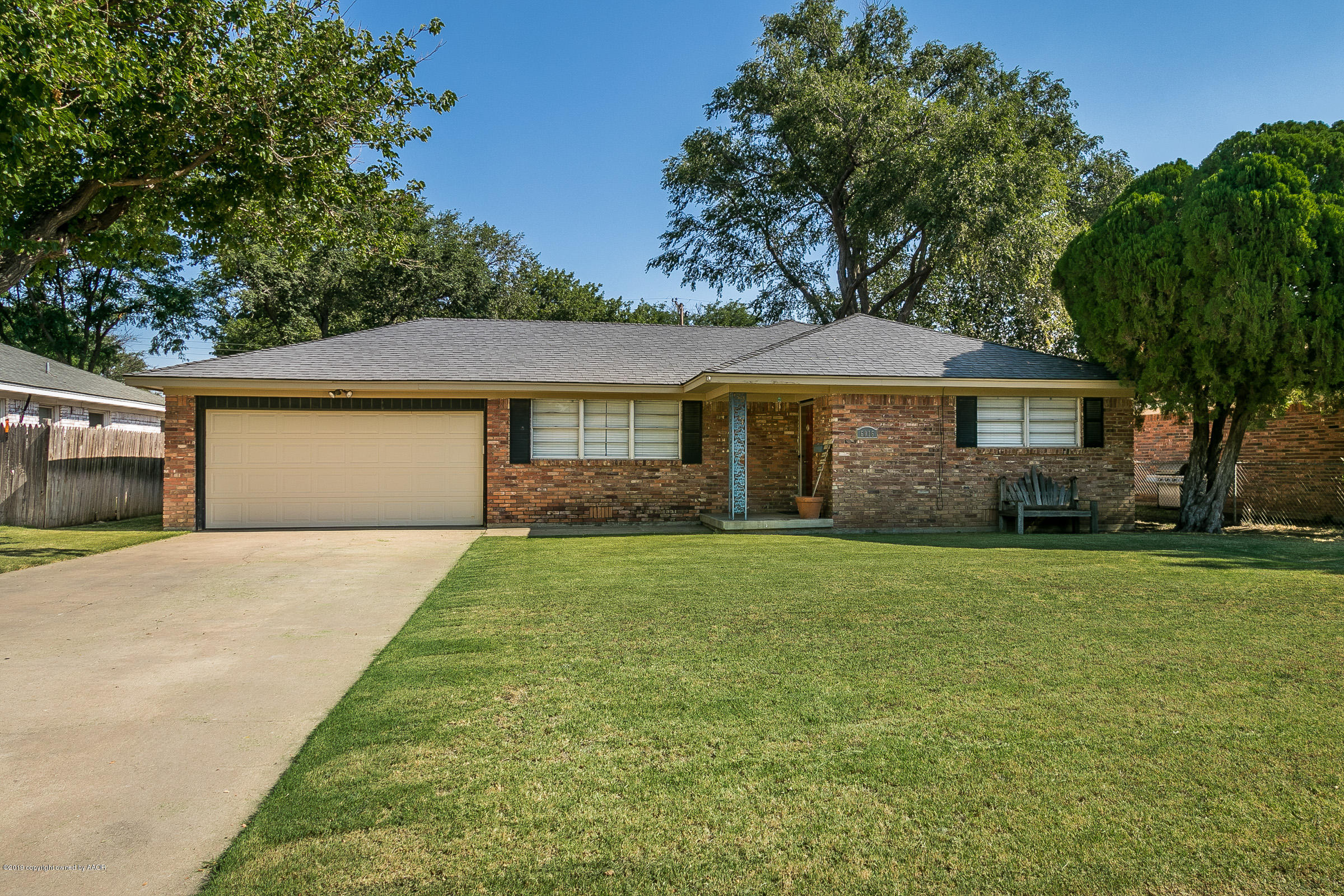 6016 Elmhurst Road Amarillo, TX 79106 - Photo 1 of 21 a front view of a house with a garden
