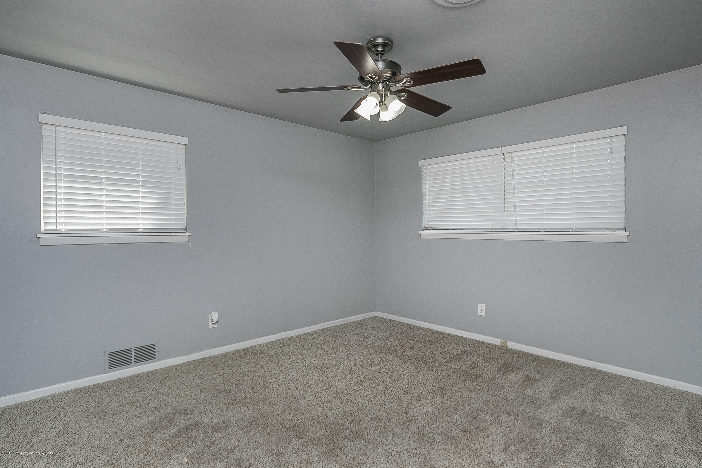 6016 Elmhurst Road Amarillo, TX 79106 - Photo 14 of 21 a view of an empty room with a window