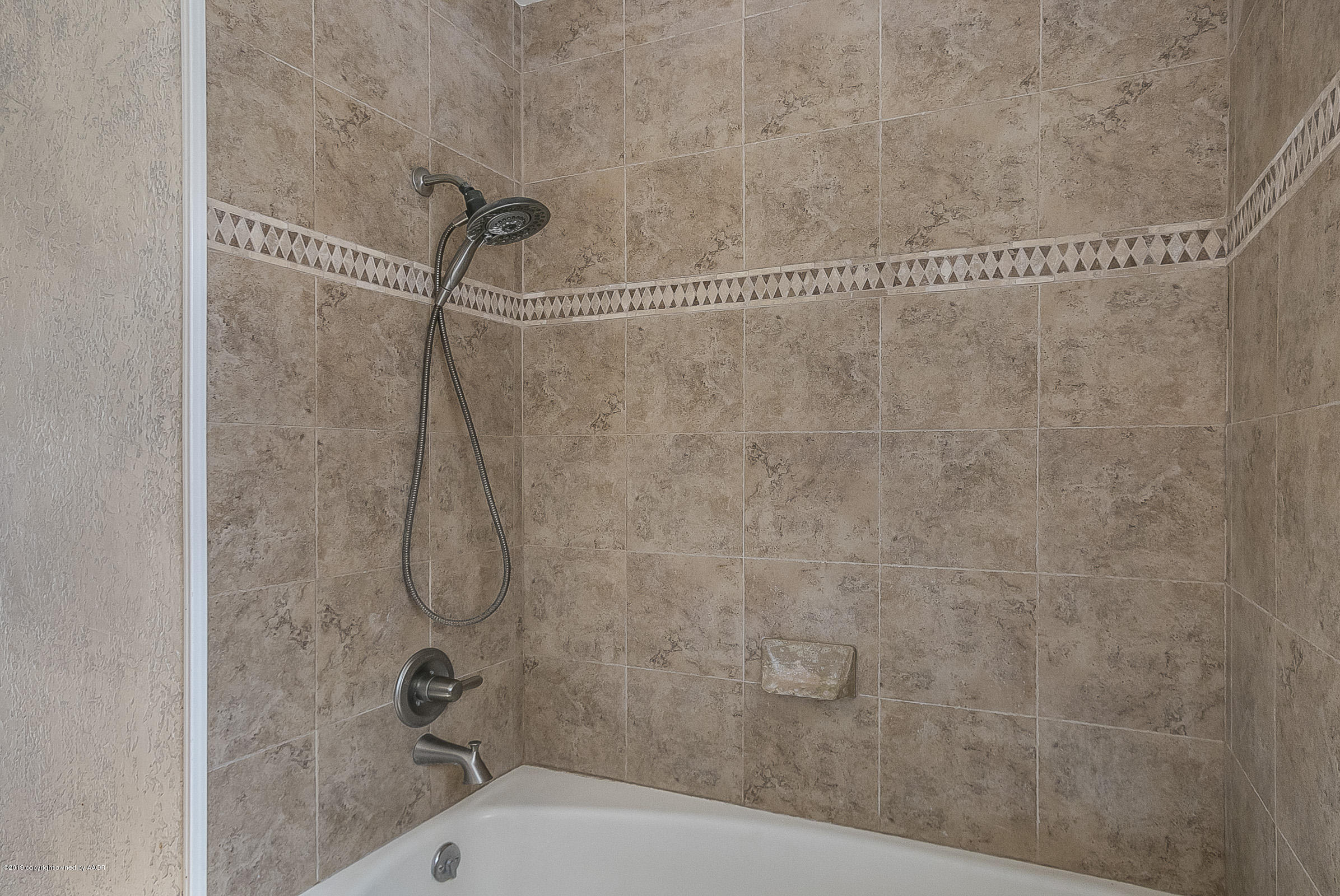 6016 Elmhurst Road Amarillo, TX 79106 - Photo 17 of 21 a bathroom with a shower