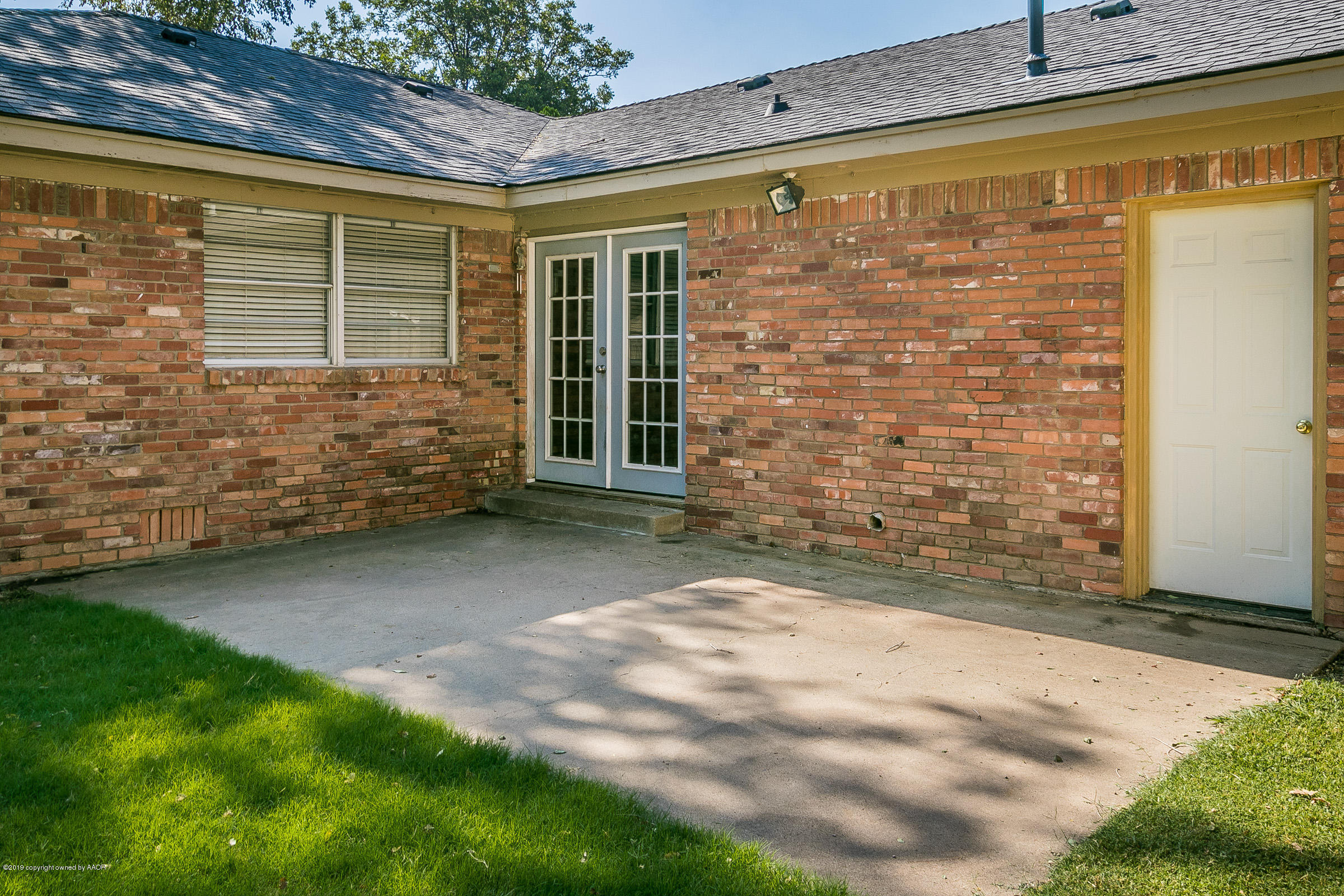 6016 Elmhurst Road Amarillo, TX 79106 - Photo 18 of 21 a view of front door of house with an outdoor space