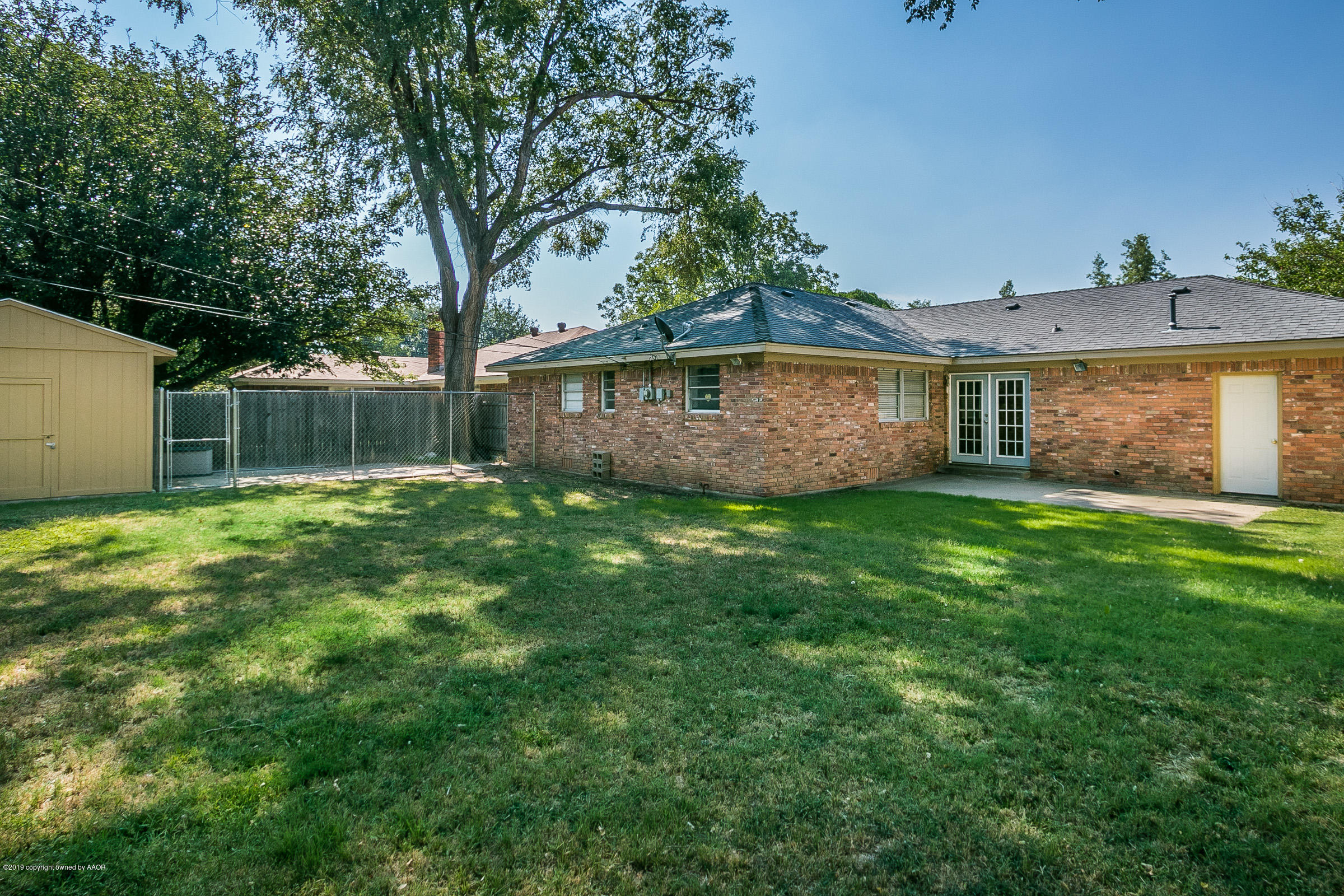 6016 Elmhurst Road Amarillo, TX 79106 - Photo 19 of 21 a view of a house with a yard