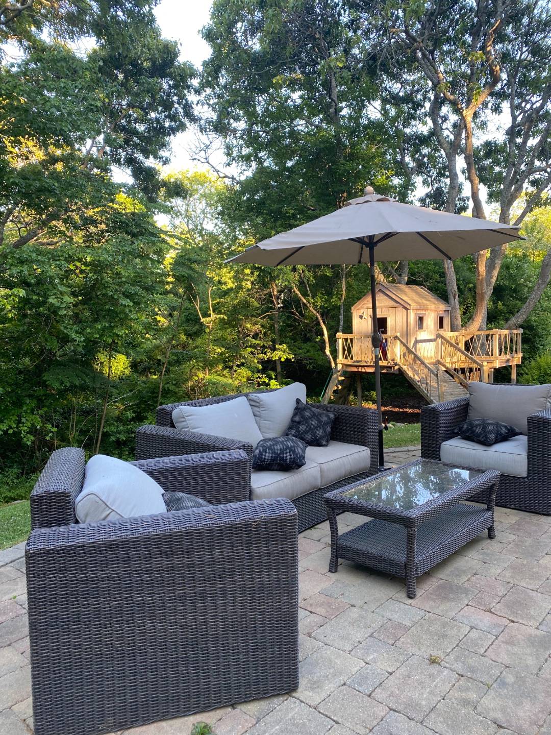 6 Wills Point Road Montauk, NY 11954 - Photo 14 of 16 a view of patio with couches table and chairs under an umbrella with a barbeque