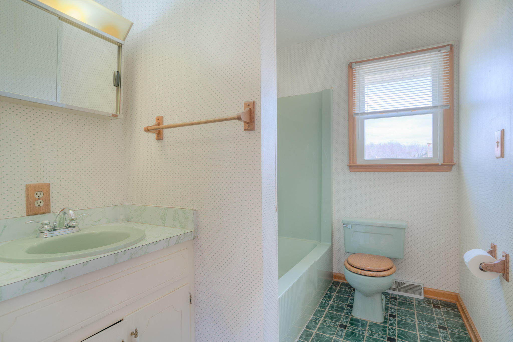 4964 Lizzie Gunn Road Pulaski, VA 24301 - Photo 13 of 31 a bathroom with a toilet a sink and a window