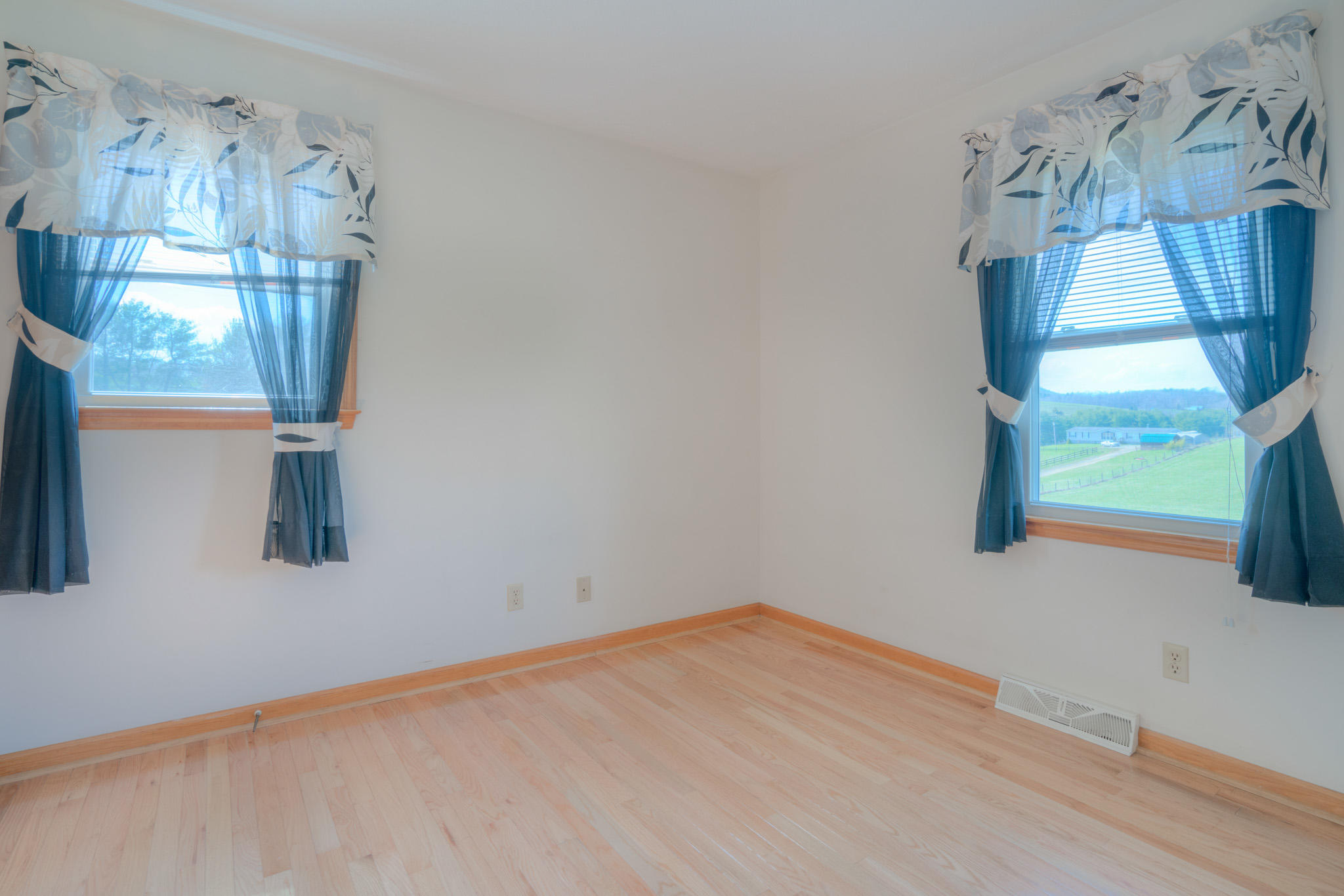 4964 Lizzie Gunn Road Pulaski, VA 24301 - Photo 14 of 31 a view of empty room with wooden floor and fan