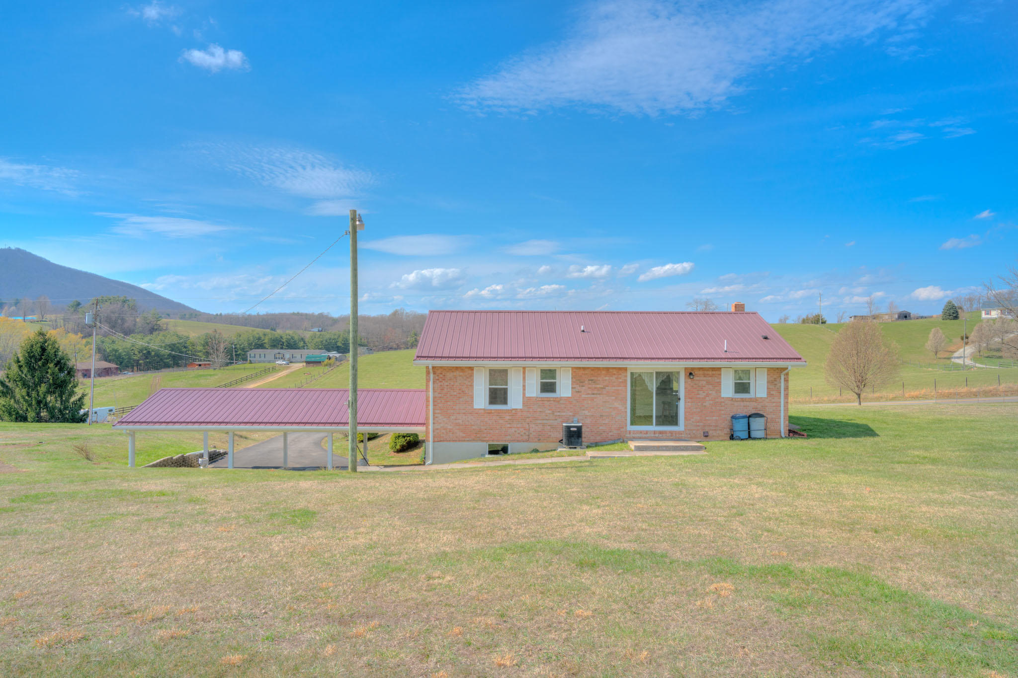 4964 Lizzie Gunn Road Pulaski, VA 24301 - Photo 22 of 31 a view of a house with a big yard
