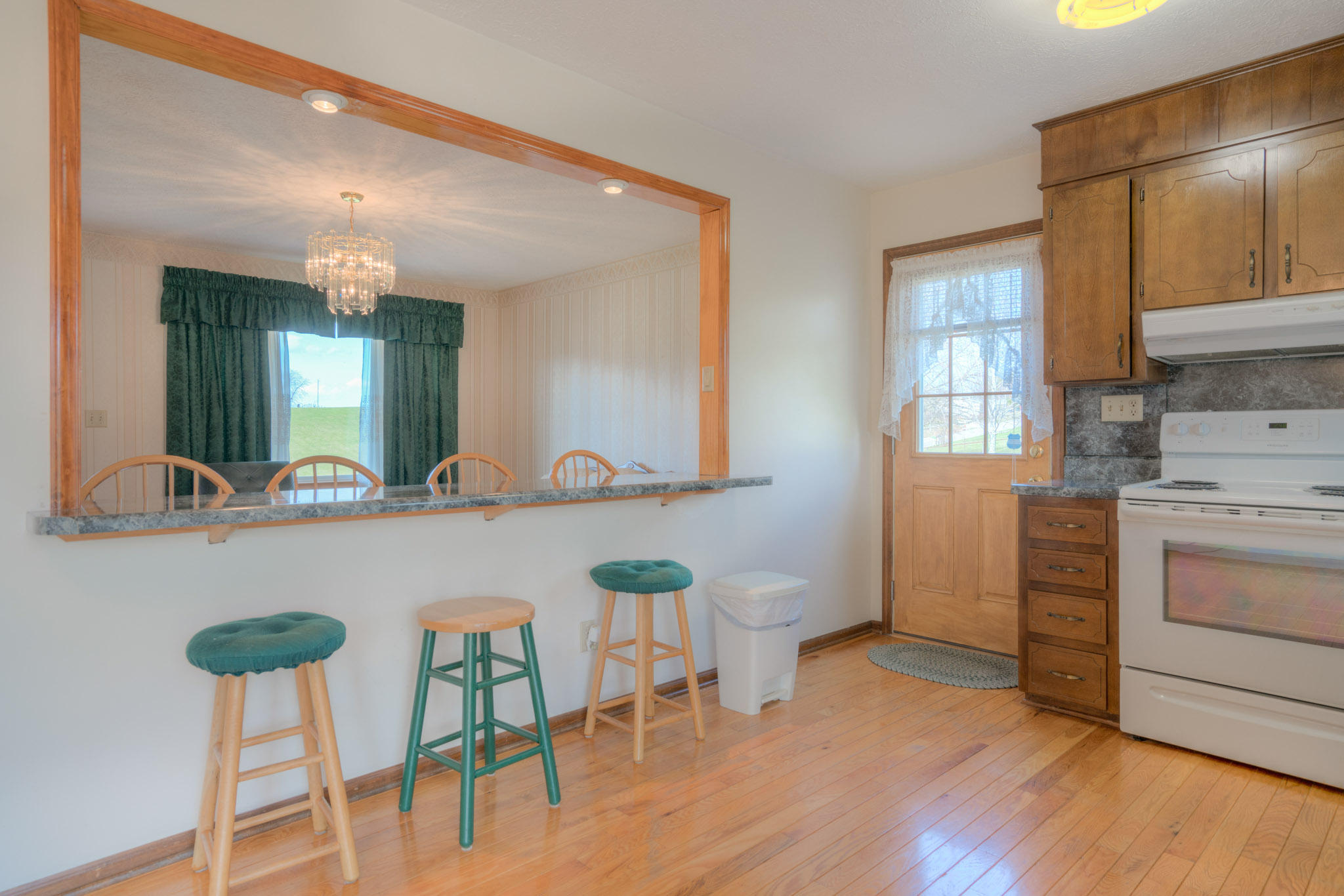 4964 Lizzie Gunn Road Pulaski, VA 24301 - Photo 10 of 31 a kitchen with a table chairs sink and cabinets
