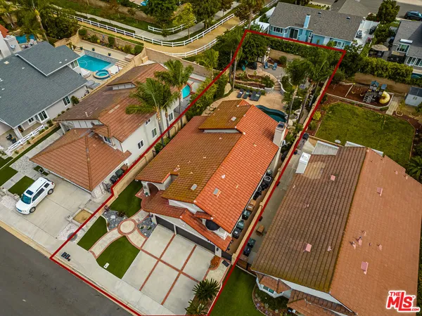 an aerial view of a house with a garden