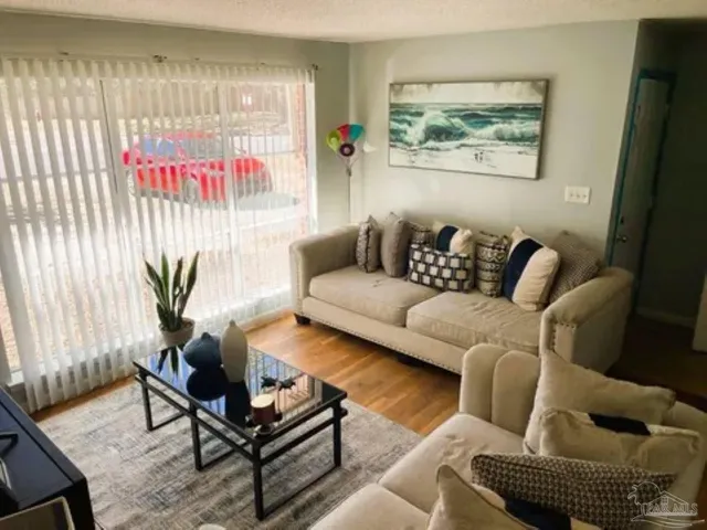 a living room with furniture and a window