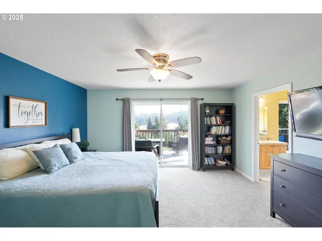 a bedroom with a bed and a television with the outer view