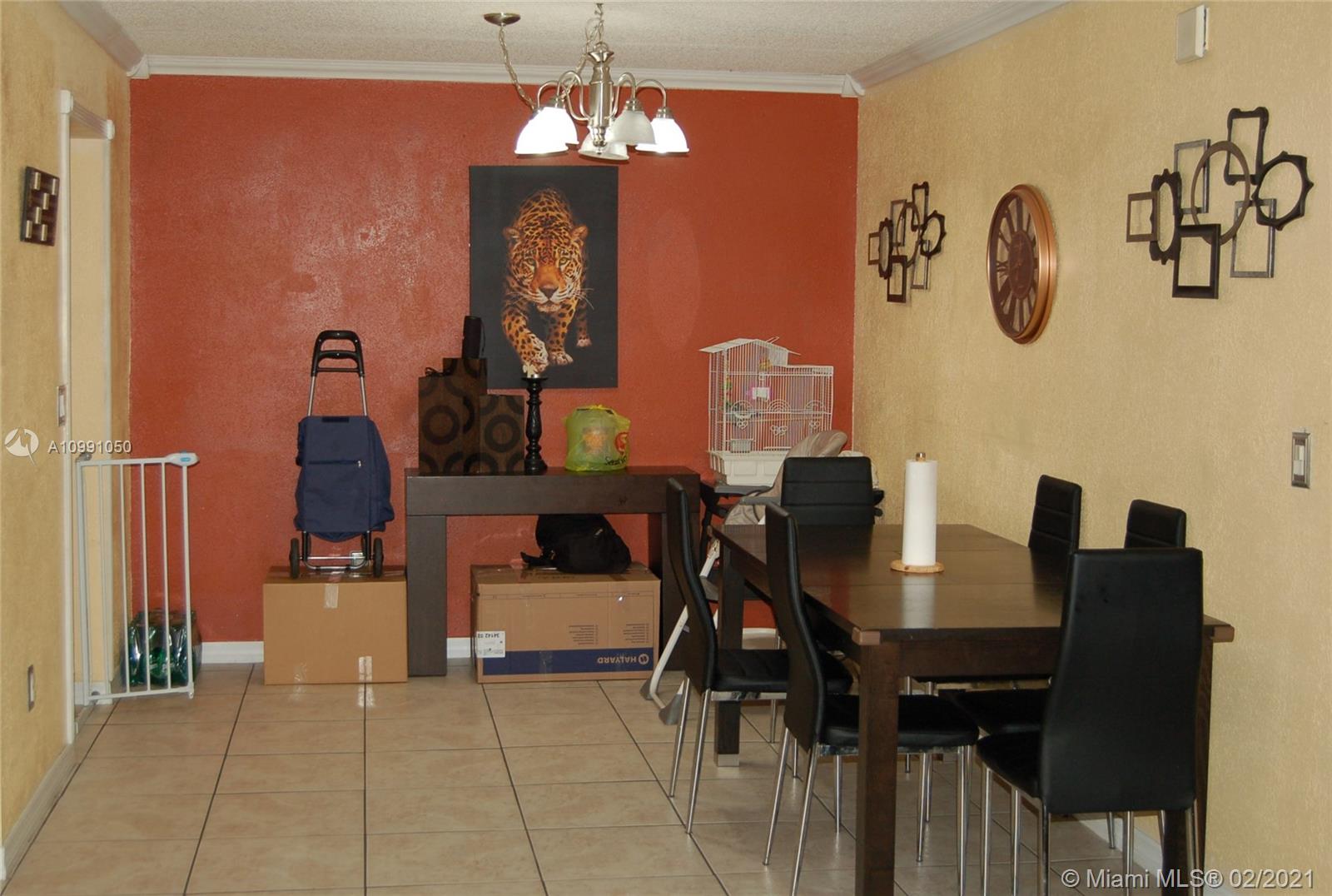 8600 Southwest 149th Avenue, Unit 612 Miami, FL 33193 - Photo 2 of 8 Spacious dining room with moldings and trim work