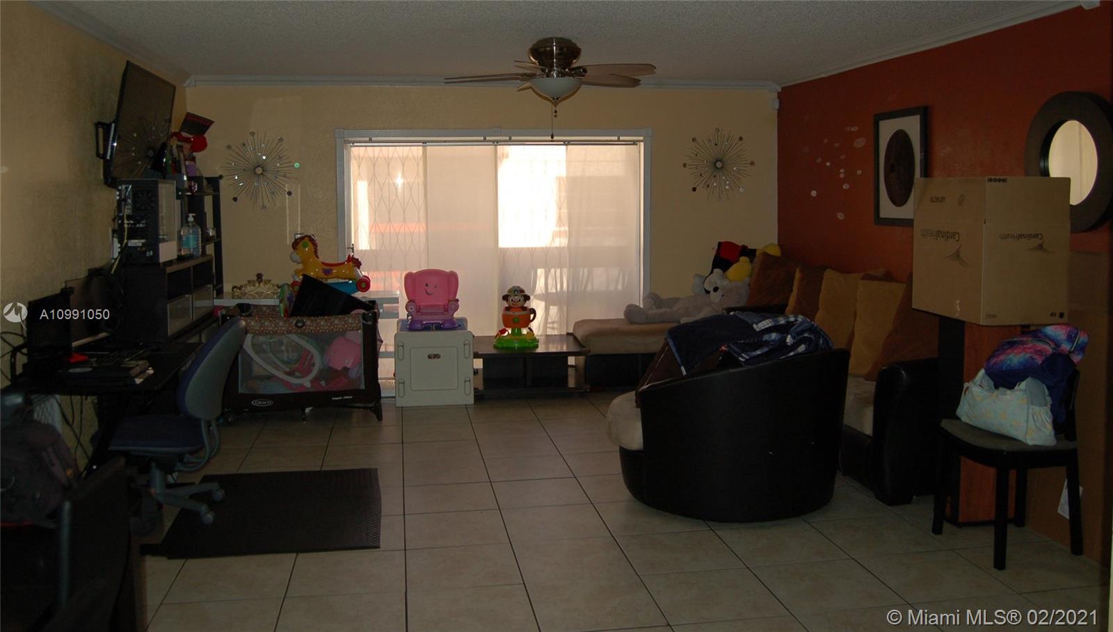 8600 Southwest 149th Avenue, Unit 612 Miami, FL 33193 - Photo 5 of 8 Generous living room with open balcony