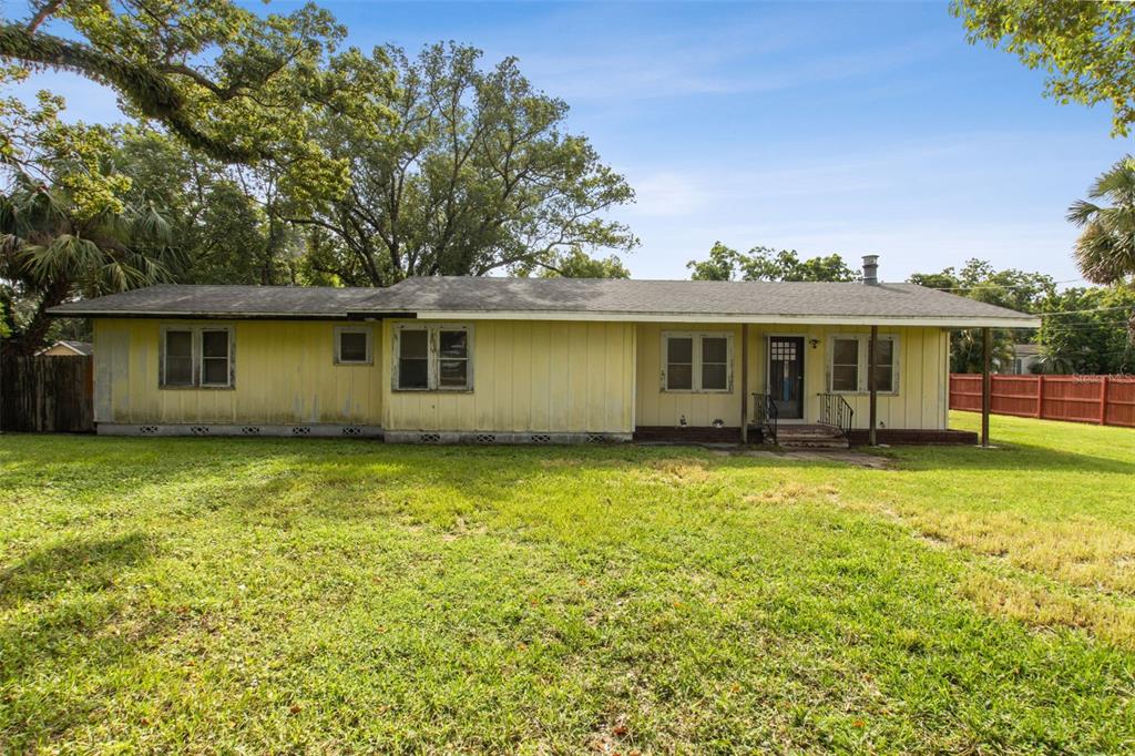 Undisclosed Address Ocoee, FL 34761 - Photo 1 of 23 a view of a house with a backyard