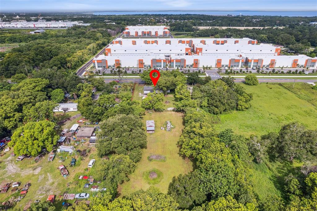 Undisclosed Address Ocoee, FL 34761 - Photo 22 of 23 an aerial view of residential houses with outdoor space and trees