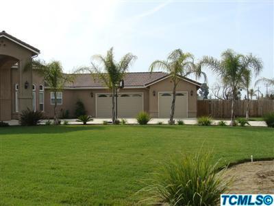 164 South Cornucopia Road Exeter, CA 93221 - Photo 2 of 9 a front view of a house with garden