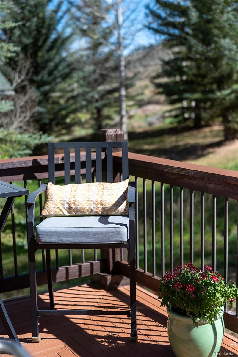 290 Village Road Granby, CO 80446 - Photo 40 of 45 a view of a balcony with chairs and a potted plant