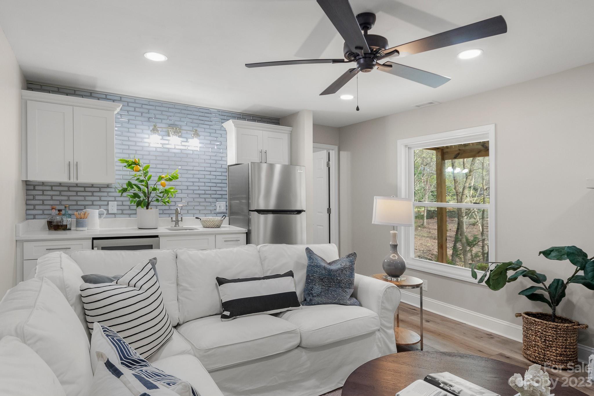 7022 Chelsea Day Lane Tega Cay, SC 29708 - Photo 11 of 48 a living room with furniture and a large window