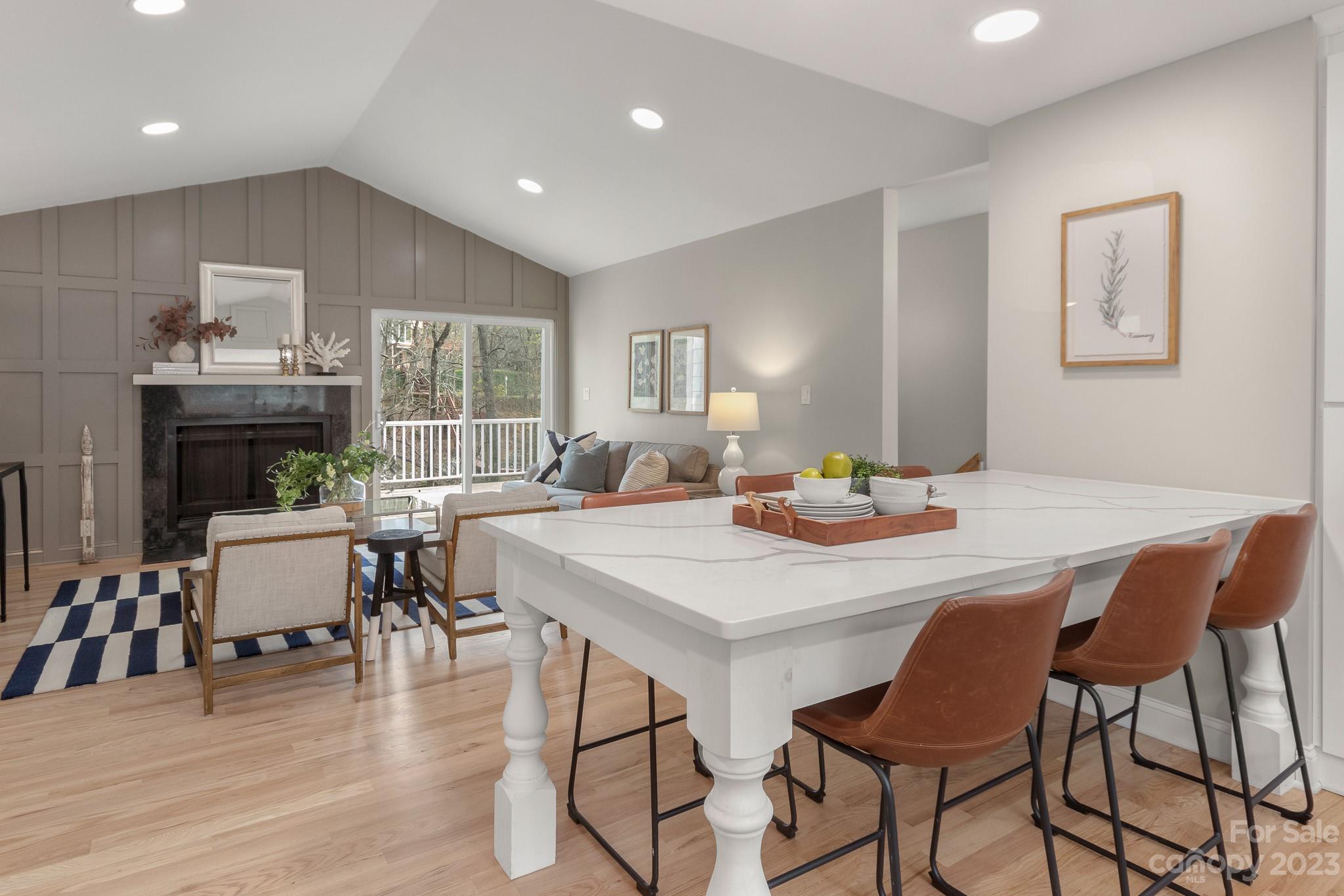 7022 Chelsea Day Lane Tega Cay, SC 29708 - Photo 12 of 48 a view of a dining room with furniture and wooden floor