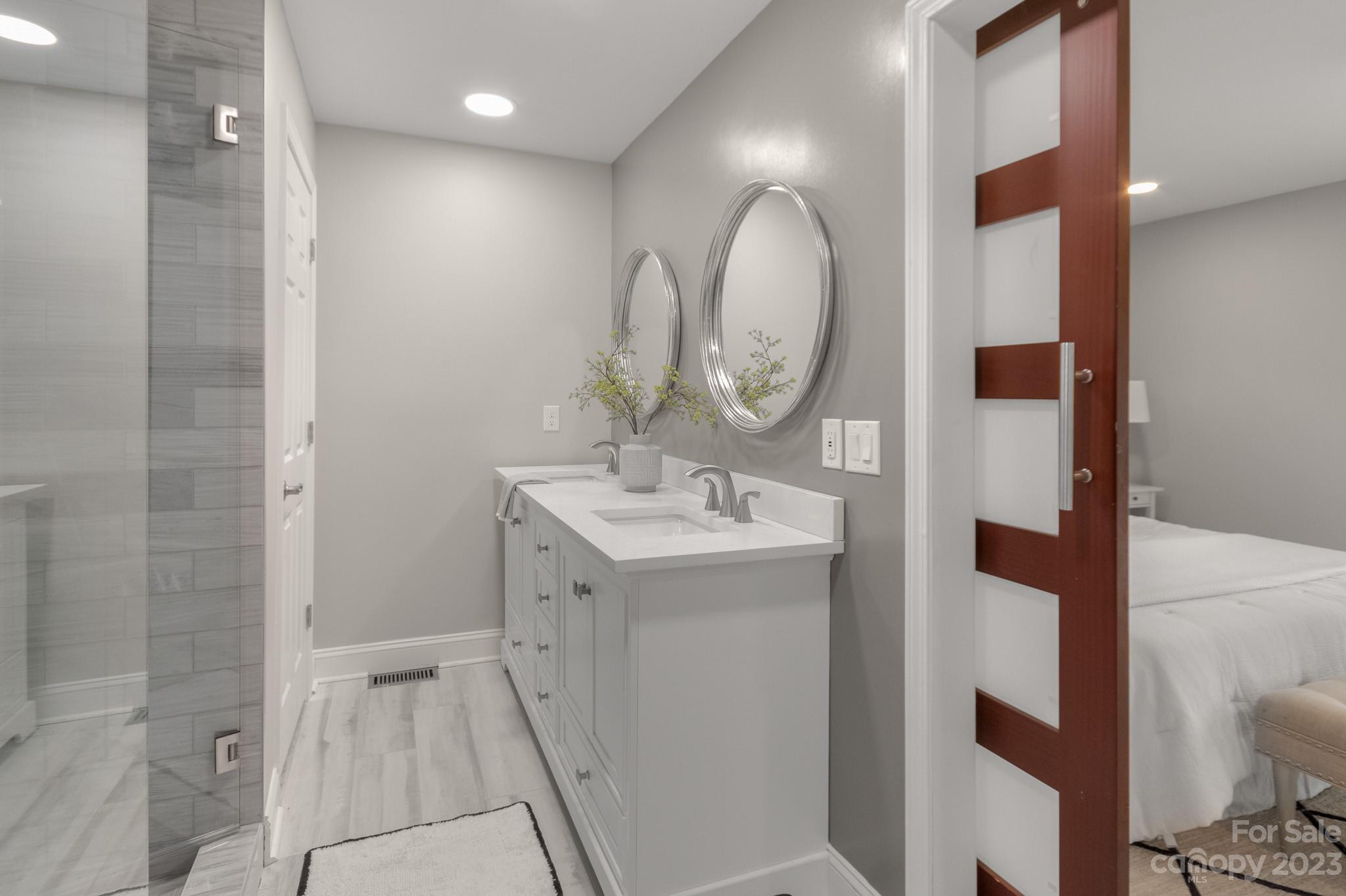 7022 Chelsea Day Lane Tega Cay, SC 29708 - Photo 19 of 48 a bathroom with a sink and a mirror