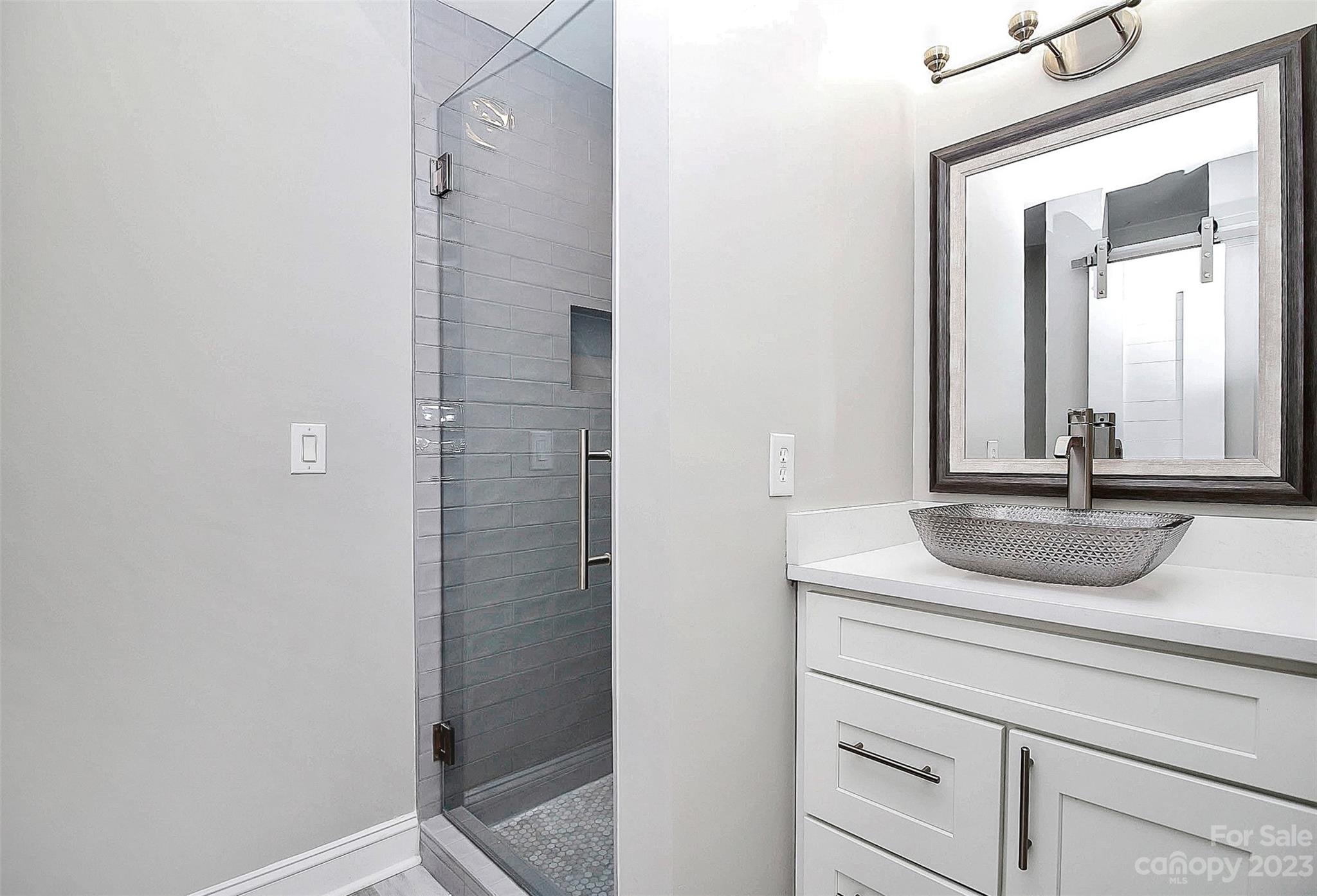 7022 Chelsea Day Lane Tega Cay, SC 29708 - Photo 24 of 48 a bathroom with a sink and a mirror