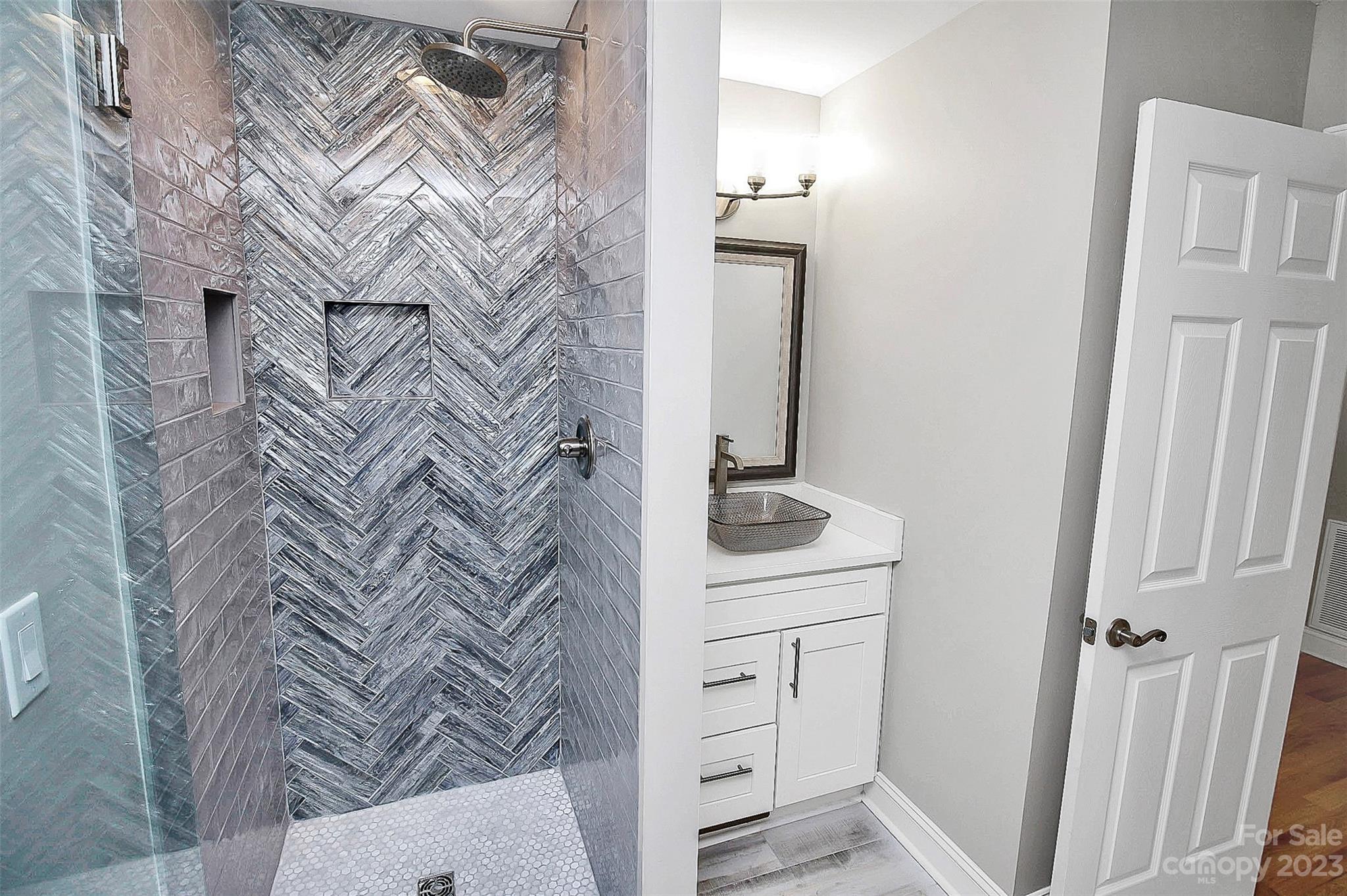7022 Chelsea Day Lane Tega Cay, SC 29708 - Photo 25 of 48 a bathroom with a sink and vanity