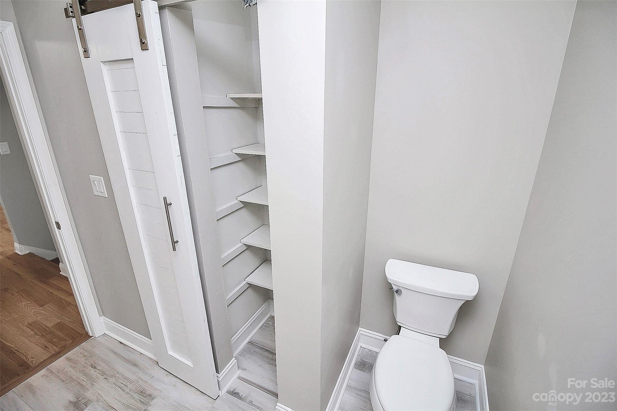 7022 Chelsea Day Lane Tega Cay, SC 29708 - Photo 26 of 48 a white toilet sitting next to a shower