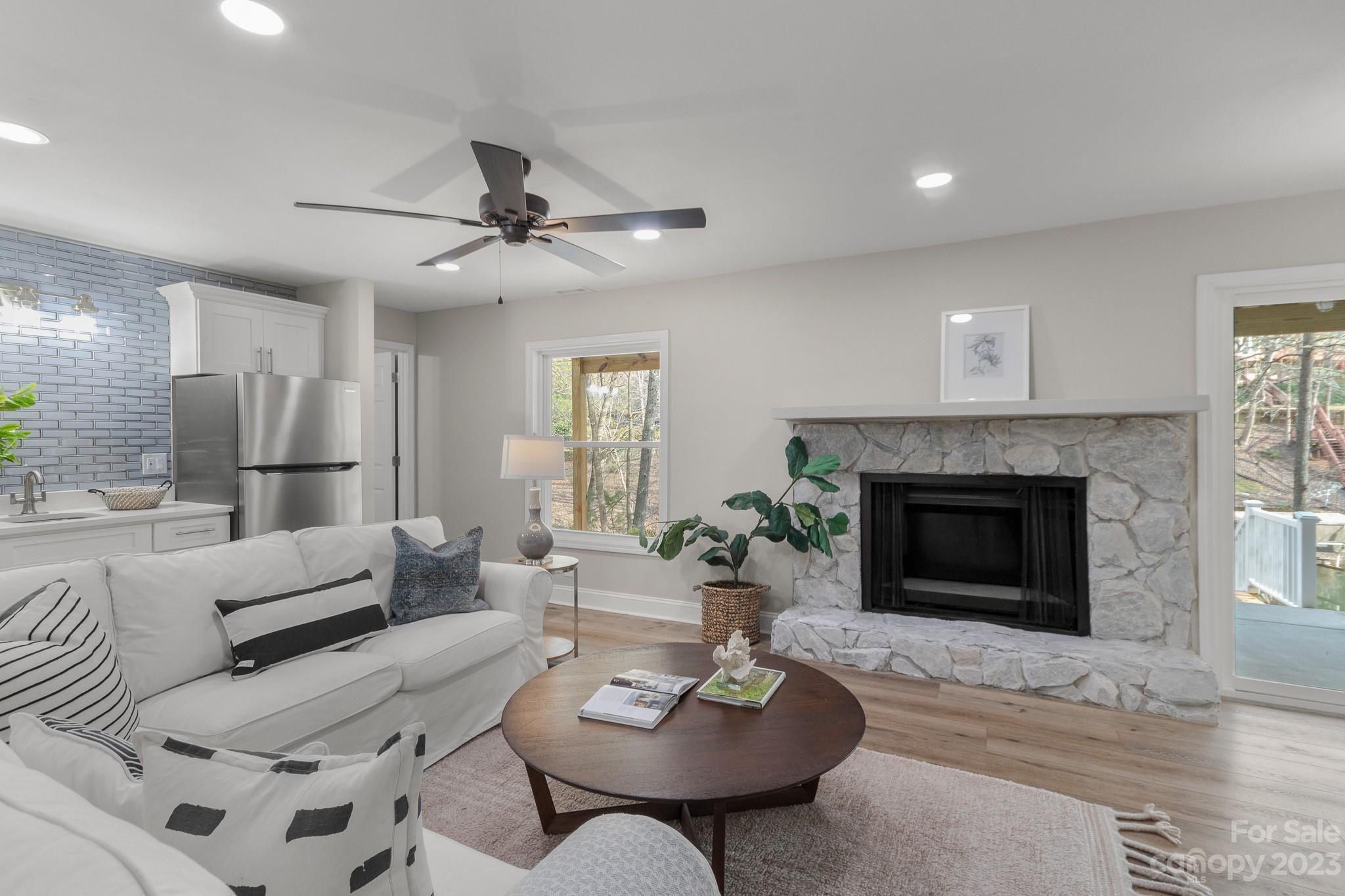 7022 Chelsea Day Lane Tega Cay, SC 29708 - Photo 27 of 48 a living room with furniture and a fireplace