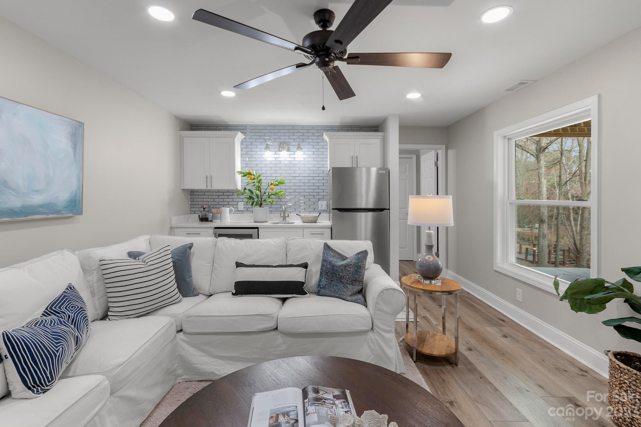 7022 Chelsea Day Lane Tega Cay, SC 29708 - Photo 29 of 48 a living room with furniture and a large window