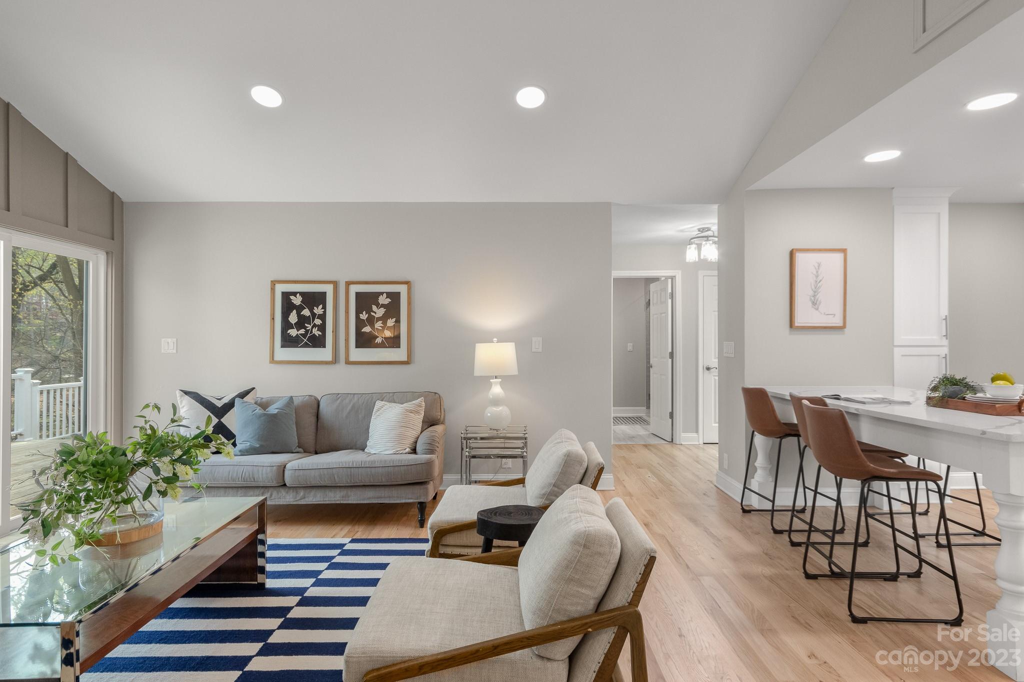7022 Chelsea Day Lane Tega Cay, SC 29708 - Photo 3 of 48 a living room with furniture and wooden floor
