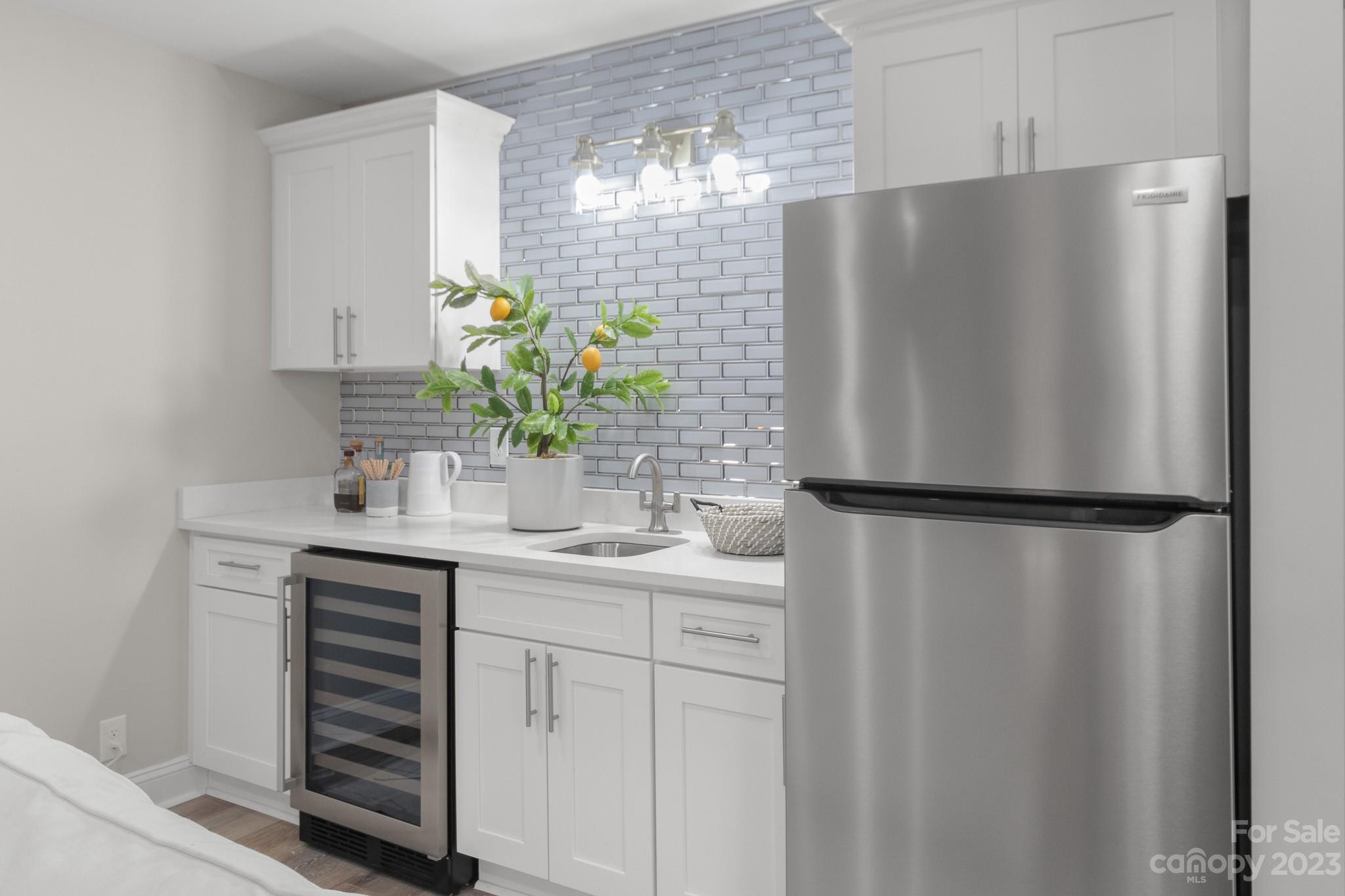 7022 Chelsea Day Lane Tega Cay, SC 29708 - Photo 31 of 48 a kitchen with stainless steel appliances a refrigerator and a sink